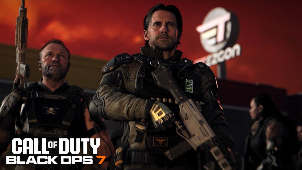Promotional artwork for Call of Duty: Black Ops 7 featuring three gritty soldiers standing against a dark, fiery red sky. In the foreground, a stern-looking male soldier with dark hair and a beard leads the group, clad in tactical black body armor and holding a futuristic rifle across his chest. To his left, an older, weathered soldier with a shaved head and tattoos looks upward, holding his weapon vertically. In the background, the silhouette of a building with a glowing "T" logo is visible. The bottom-left corner features the game's official logo: "CALL OF DUTY BLACK OPS 7" with the "7" highlighted in orange.