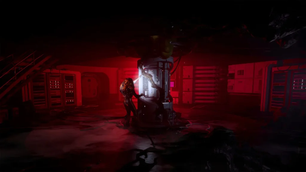 A cinematic, wide-angle shot of a dark, sci-fi interior bathed in a deep red emergency light. In the center, a lone figure in a yellow and black futuristic spacesuit leans against a large, glowing white cylindrical pillar or power core. Dark, organic, vine-like structures appear to be growing out of the ceiling and wrapping around the central pillar. The background features server racks, control panels, and a staircase, all shrouded in shadow and red light, creating an atmosphere of tension and cosmic horror.