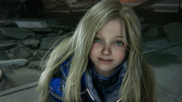 A close-up, high-angle shot of a young girl with long, wavy blonde hair and striking green eyes. She is looking upward with a faint, hopeful smile. She wears a futuristic or tactical blue suit with grey padded collar details. The background is a dim, cinematic setting featuring blurred rubble and concrete debris, suggesting a post-apocalyptic or sci-fi environment.